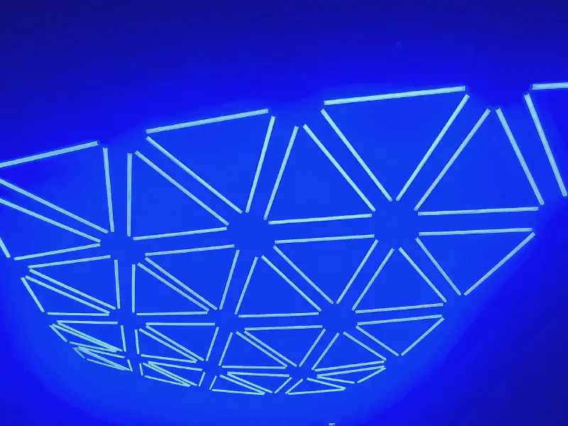 Blue glowing triangles on the GRID ceiling