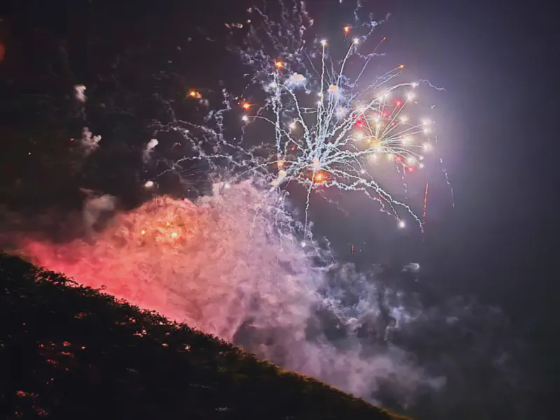 White starburst effect and pink glowing smoke