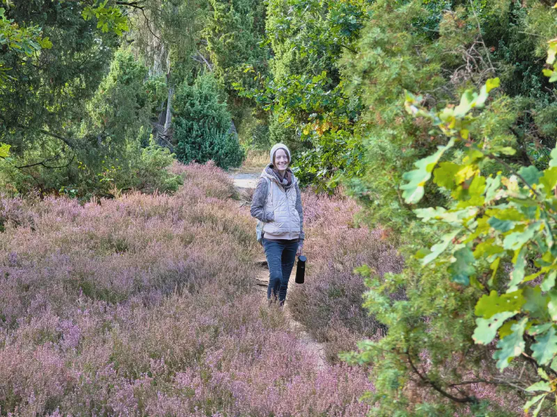 Gina on the narrow sandy path through the heath